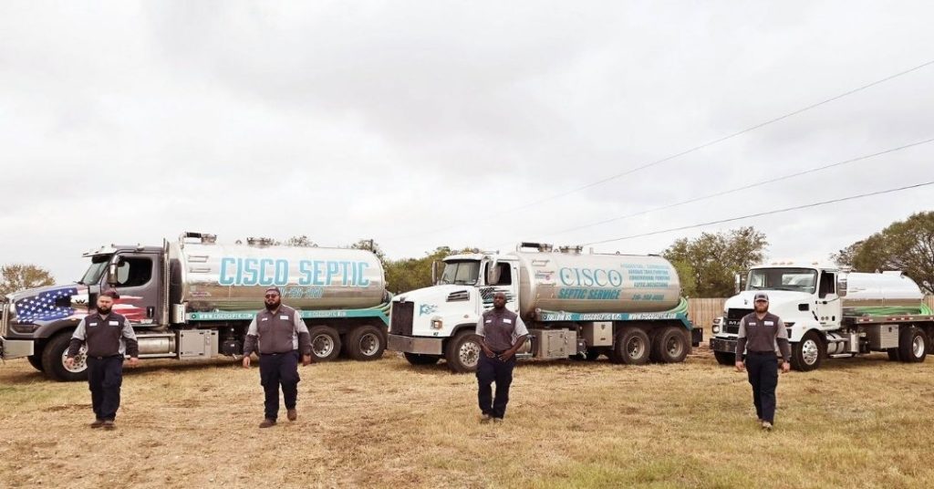 cisco septic truck and man